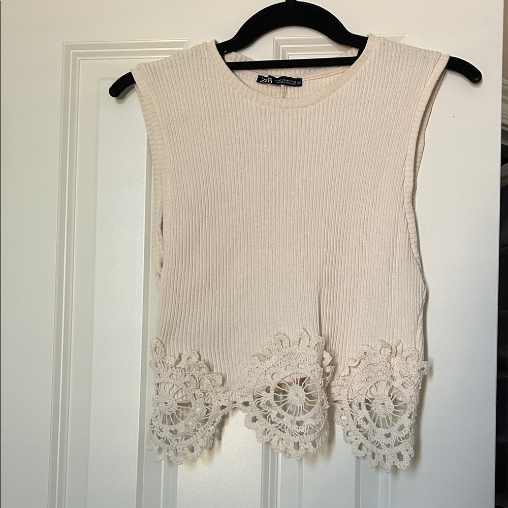 Elegant Cream Sleeveless Top with Lace Hem